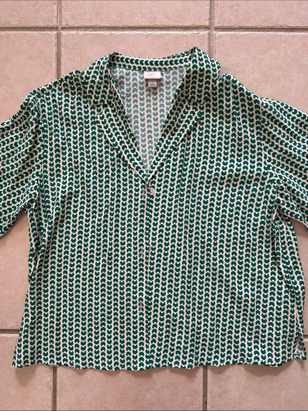 A. New Day Woman’s Green Moon Print Button Up